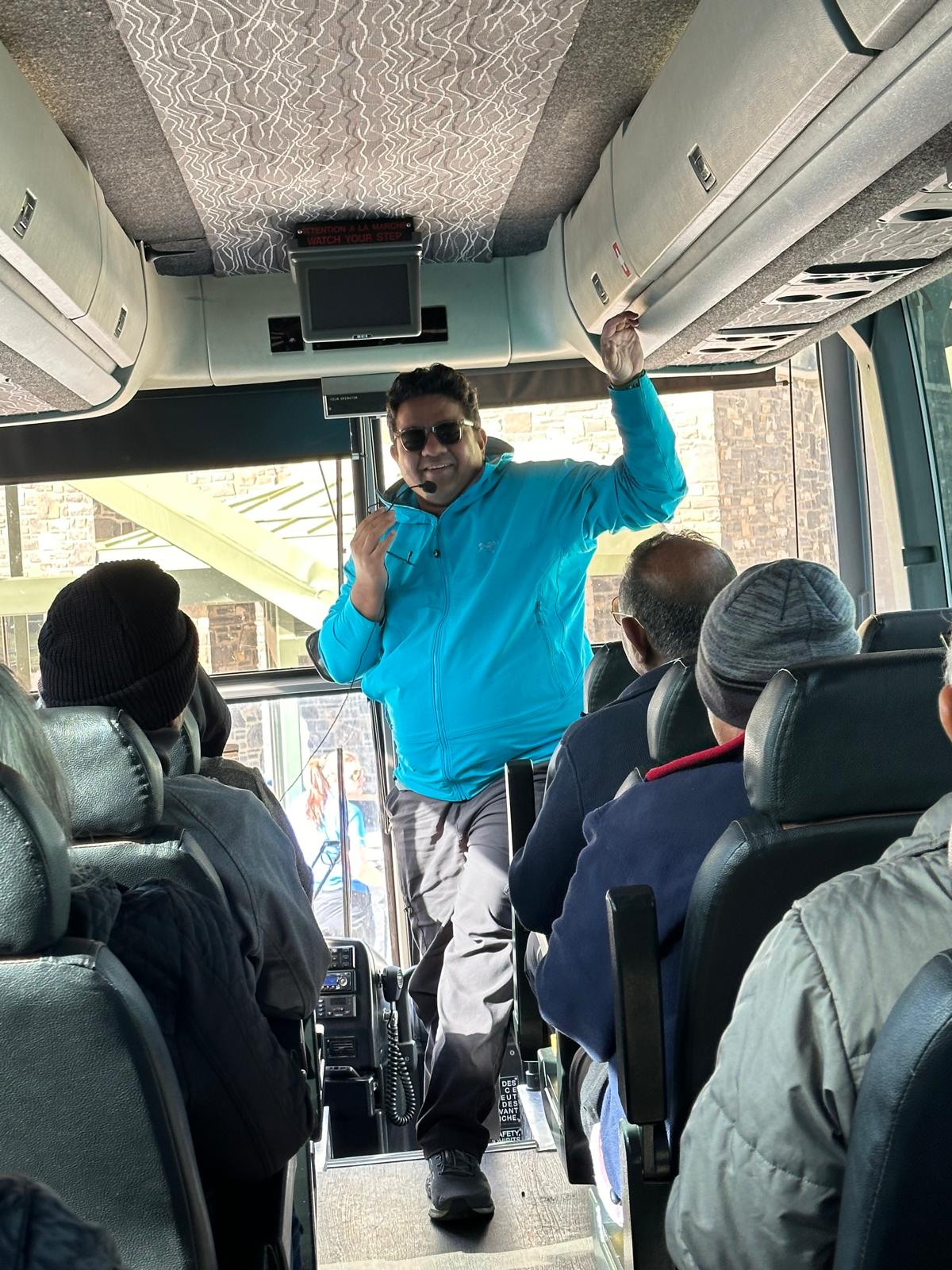 Abhishek guiding his group on the tour bus